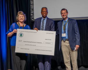 HUD Regional Administrator Ulysses "Deke" Clayborn presents check to KHRC staff