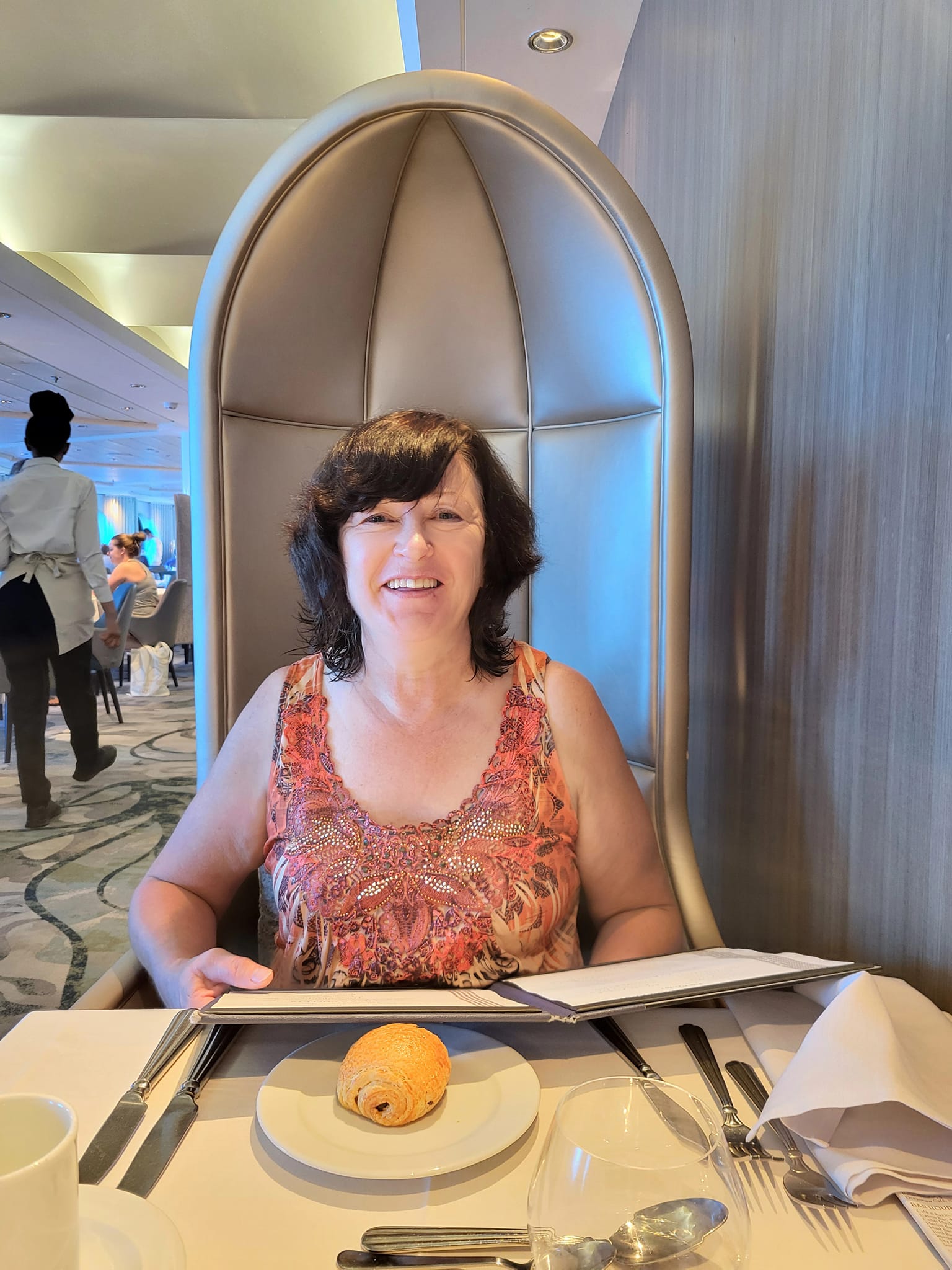 Irene indulges in fine dining aboard a cruise with colleague Christy Carter.